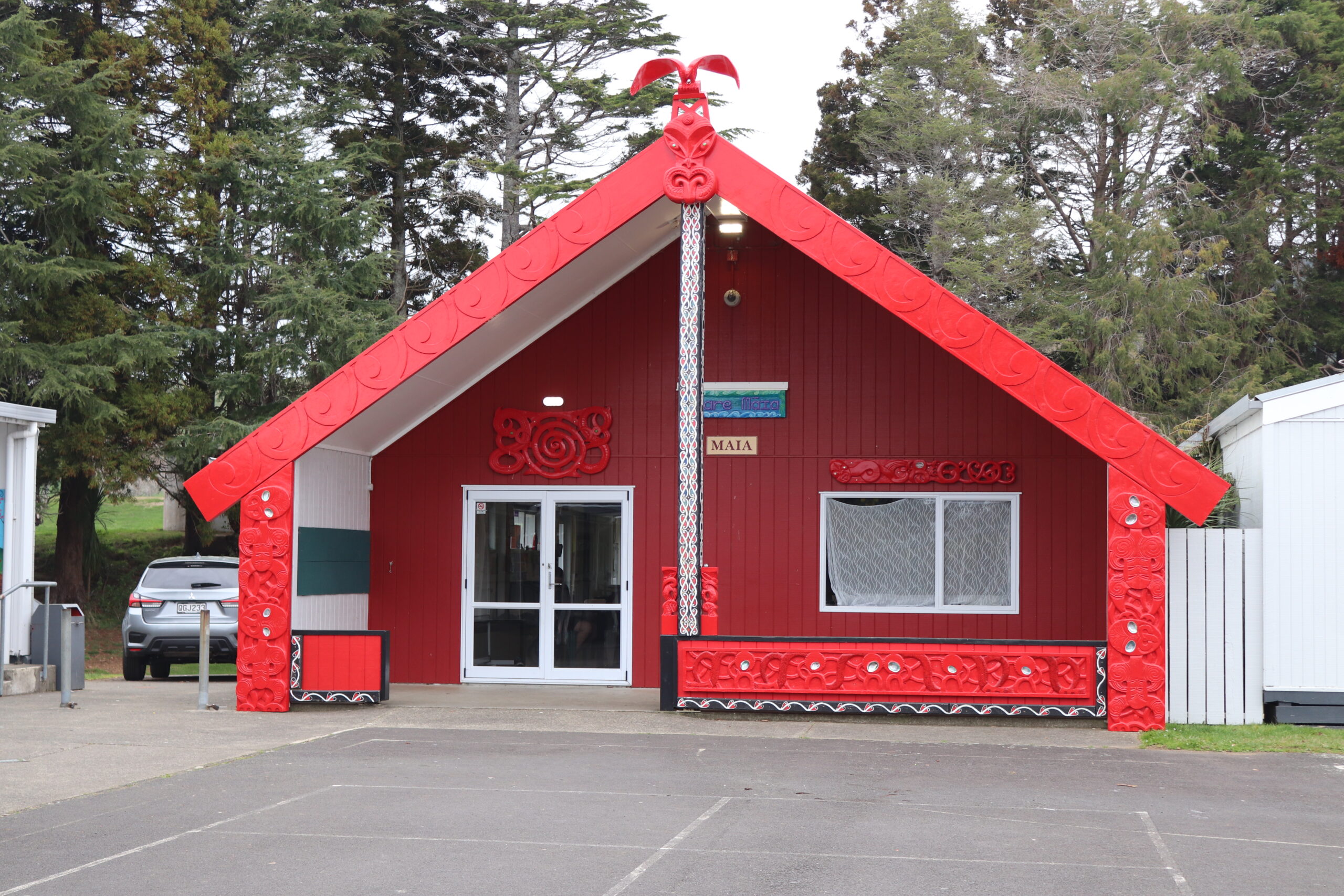 Whare Maia carvings
